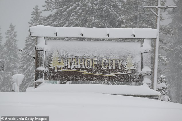 A view of snow blanketed welcome sign in Tahoe City, California, United States on Friday as blizzard warning issued for California's Sierra Nevada