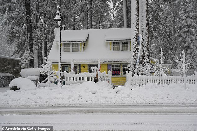 A view of snow blanketed road in Lake Tahoe, California as a blizzard warning was issued for California's Sierra Nevadas