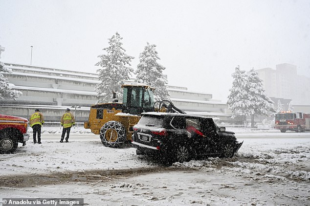 A vehicle collided with a snowplow as snow blanketed roads in South Lake Tahoe, California