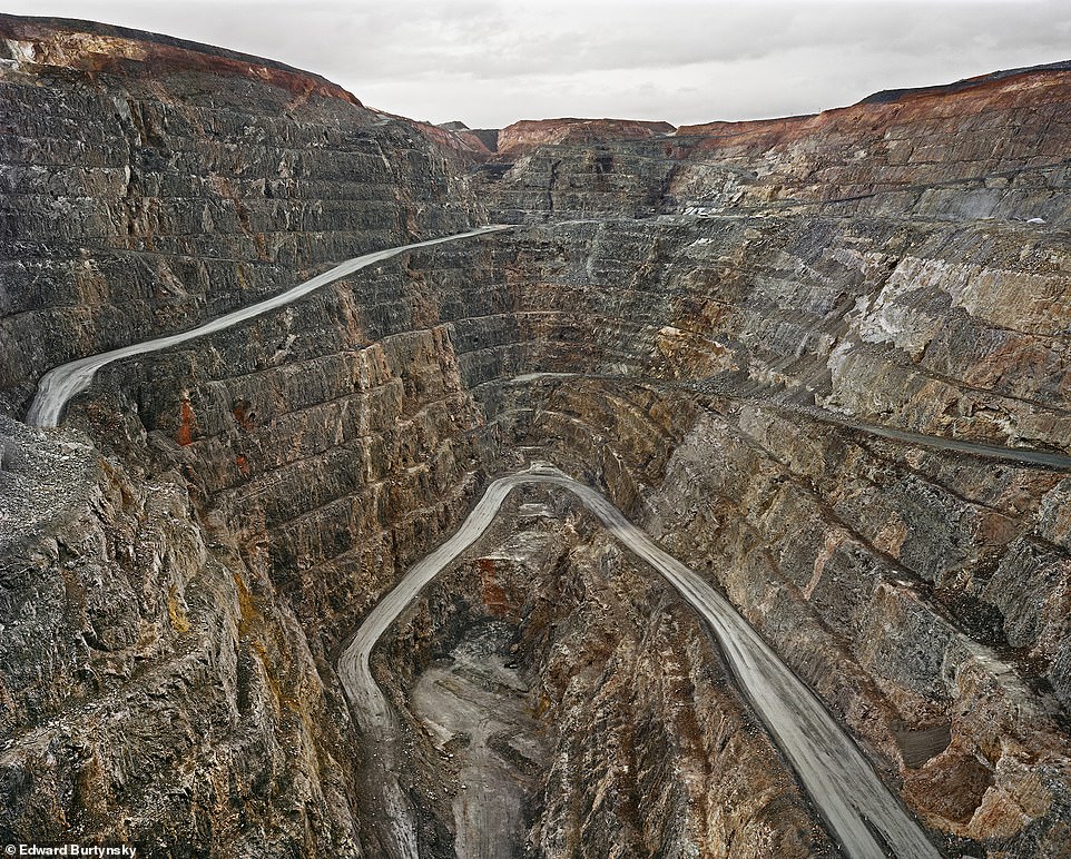 SUPER PIT, KALGOORLIE, WESTERN AUSTRALIA, 2007: The book says: 'The Fimiston open pit, known locally as "Super Pit", is a 600-metre-deep gold mine. It was the largest in Australia until it was surpassed in 2016. Nevertheless, it remains a popular local tourist attraction with a lookout over the operation. Sightseers come to view these deep excavations, also known as open cast or open cut pits, to behold the exposure of millions of years of geologic time'