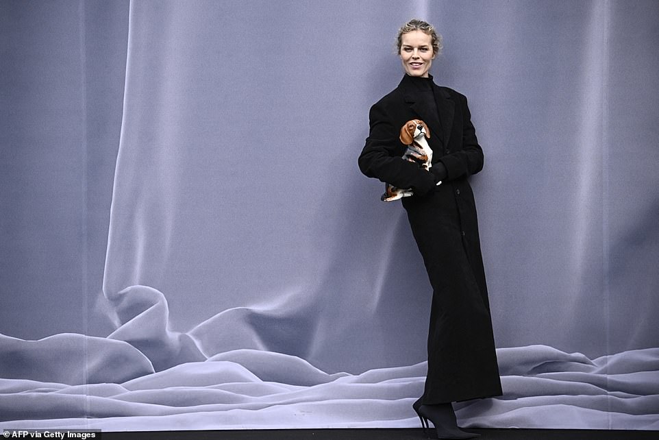 Czech model Eva Herzigova poses as she arrives for the presentation of creations by Balenciaga