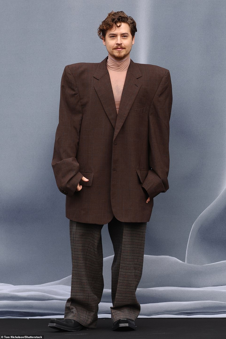 Cole Sprouse wore a brown suit
