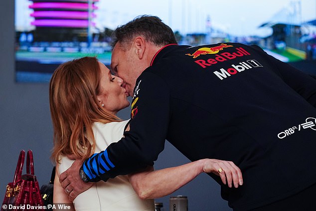 It appeared that Christian leaned in to kiss his wife in full view of the cameras as the world watched their response to the controversy that has rocked Formula One