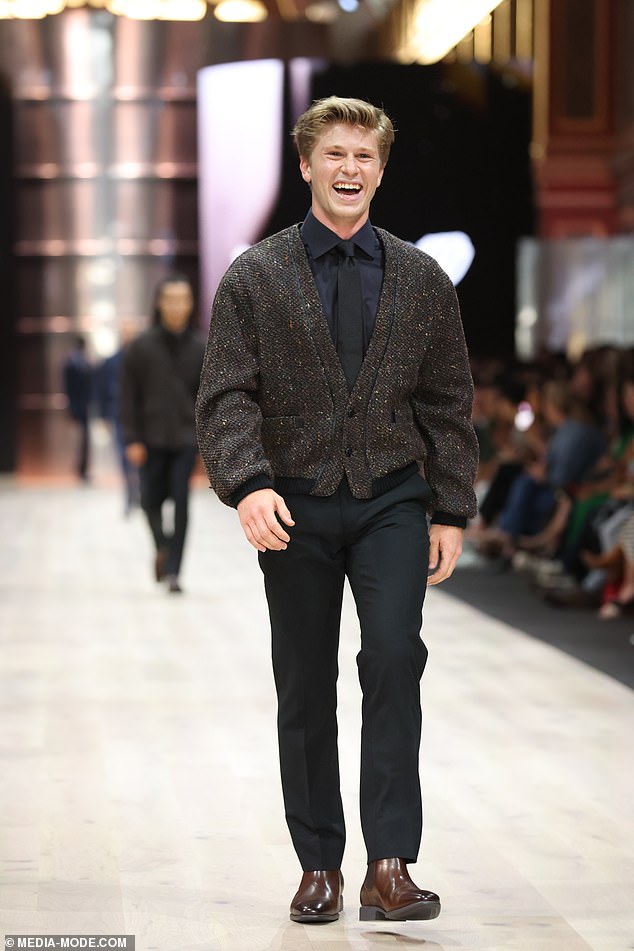 For his runway stint, Robert looked stylish in an all-black suit, styled with a dark brown tweed-style bomber jacket