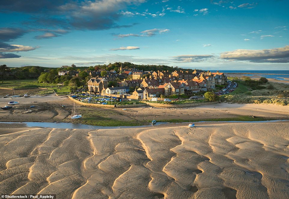 15. ALNMOUTH, NORTHUMBERLAND, ENGLAND: This 'quiet yet quaint village' is 'clinging to the edges of the North Sea. When the tide is out, the golden sands come into vision, creating a perfectly curved soft sand beach. With kite surfers taking to the waters and colourful townhouses in the background, it¿s a picture-perfect scene.'