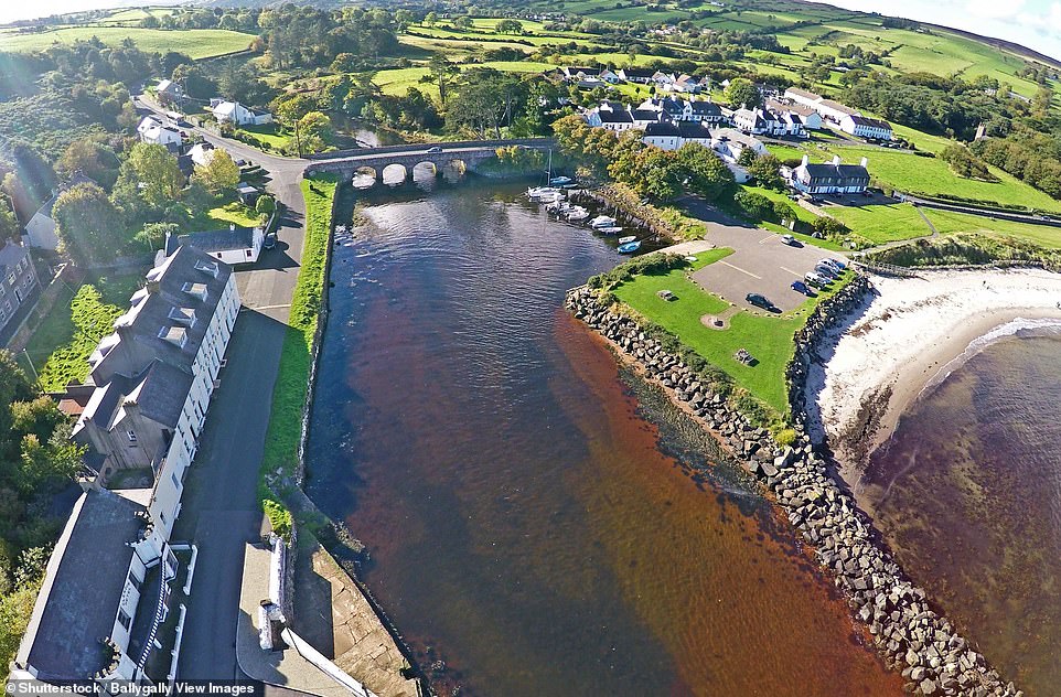 5. CUSHENDUN, COUNTY ANTRIM, NORTHERN IRELAND: There's 'lots to love' in Cushendun, from the 'sheltered harbour' to the 'expansive beaches', says Big 7 Travel, adding: 'Whitewashed cottages, rose gardens, and historical buildings make up the town, while the surrounding area is full of hikes'