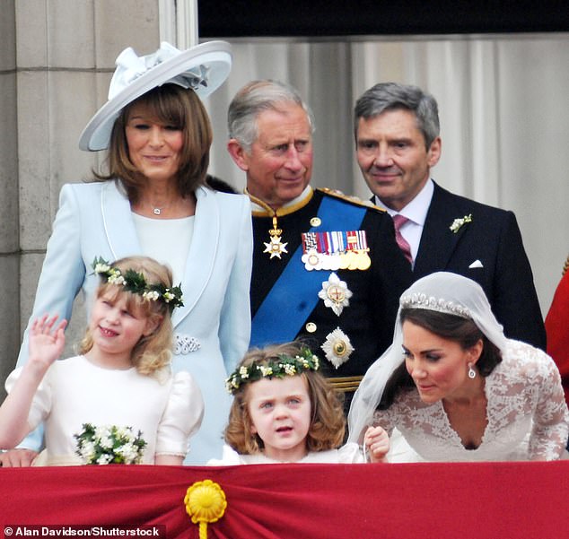 It comes following an eventful year for the Middletons. Michael and Carole pictured on the royal balcony during their daughter's wedding