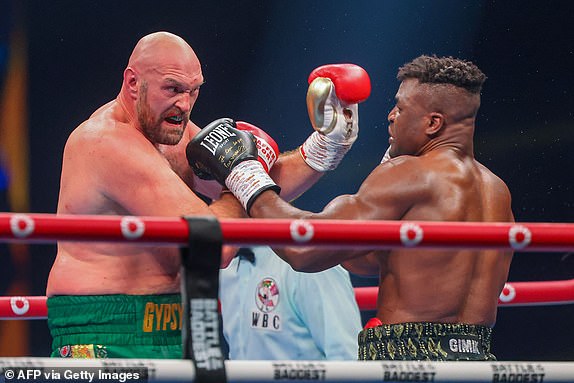Britain's Tyson Fury (L) fights against Cameroonian-French Francis Ngannou during their heavyweight boxing match in Riyadh early on October 29, 2023. (Photo by Fayez NURELDINE / AFP) (Photo by FAYEZ NURELDINE/AFP via Getty Images)