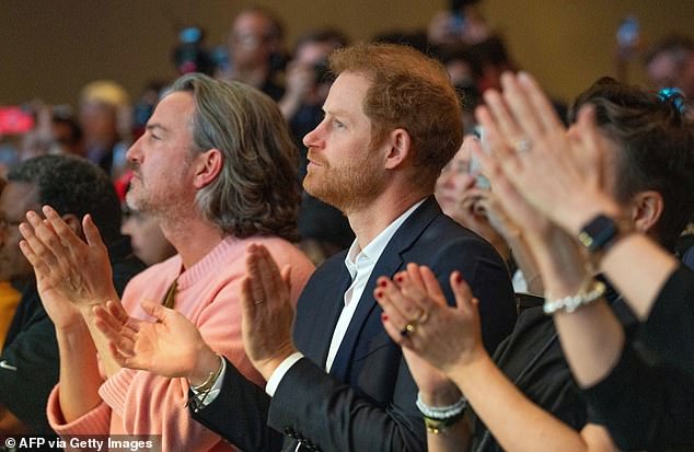 Prince Harry cheered his wife on from the front row at the panel discussion - and was joined by the couple's close friend, Soho House mogul Markus Anderson (left)