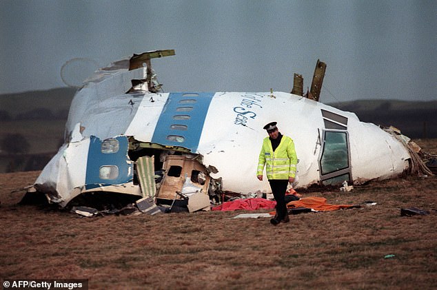 And Connor is travelling back to the past once again with his most recent project - an upcoming drama about the 1988 Lockerbie bombing. Pictured: A file image of a policeman walking away from the damaged cockpit of the 747 Pan Am airliner that exploded and crashed over Lockerbie, Scotland