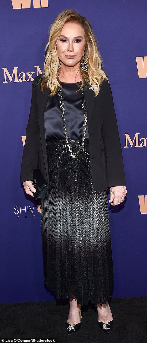 Her mother Kathy Hilton was also seen at the party although the pair did not pose together on the red carpet. The reality star looked dazzling in a navy blue satin blouse teamed with a chic, black blazer and a sparkling, pleated midi skirt