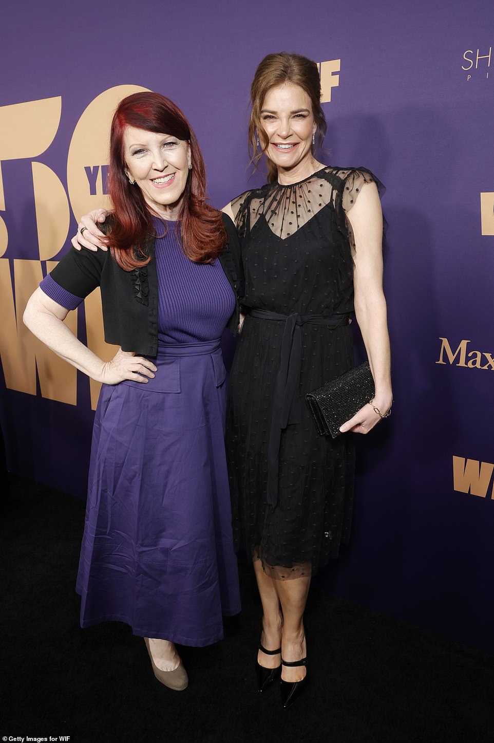 On the red carpet, Flannery was seen posing with Betsy Brandt ¿ who oped for a polkadot, all-black ensemble for the star-studded bash. The Breaking Bad star carried a sparkling clutch purse and sported pointed-toe Mary Jane heels