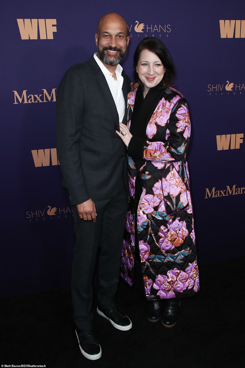 Keegan-Michael Key joined his wife Elle Key at the event in a dapper suit. He posed alongside the film producer, who wore a stunning quilted coat covered in purple flowers as her statement piece to go with her otherwise all-black ensemble