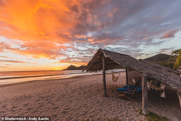 A vibrant Sunset at Morgan's Rock beach outside of San Juan Del Sur, Nicaragua