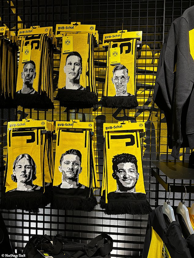 Yellow and black scarves with Sancho's face on them for sale in Dortmund's big club shop