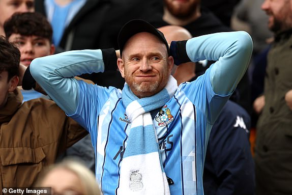WOLVERHAMPTON, ENGLAND - MARCH 16: A fan of Coventry City reacts during the Emirates FA Cup Quarter Final match between Wolverhampton Wanderers and Coventry City at Molineux on March 16, 2024 in Wolverhampton, England. (Photo by Nathan Stirk/Getty Images)