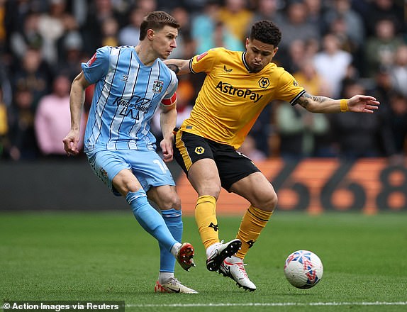 Soccer Football - FA Cup - Quarter Final - Wolverhampton Wanderers v Coventry City - Molineux Stadium, Wolverhampton, Britain - March 16, 2024 Coventry City's Ben Sheaf in action with Wolverhampton Wanderers' Joao Gomes Action Images via Reuters/Andrew Boyers