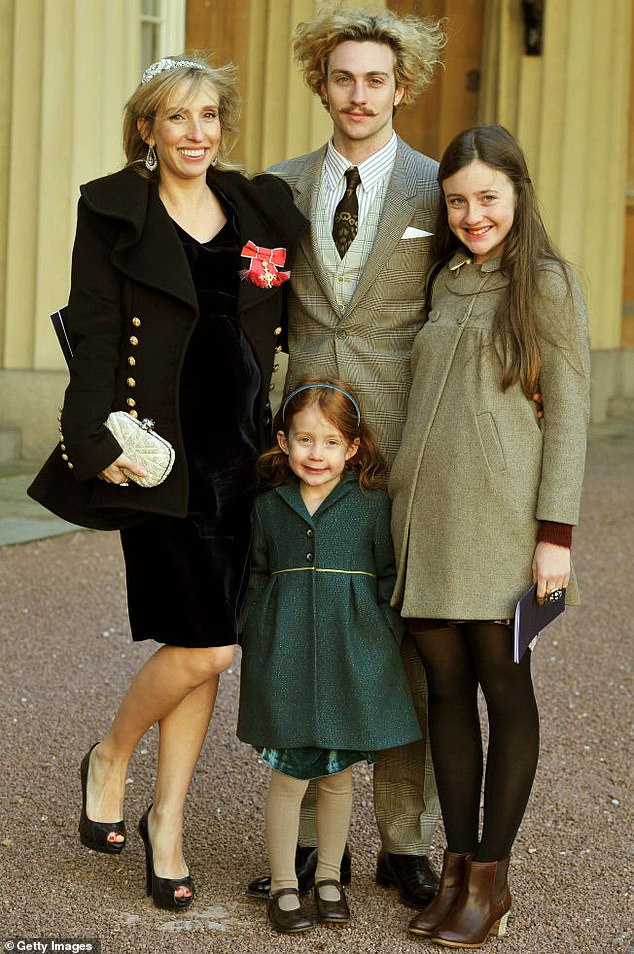 Sam is pictured pregnant with her third child with Aaron and her daughters Angelica and Jessie back in 2011