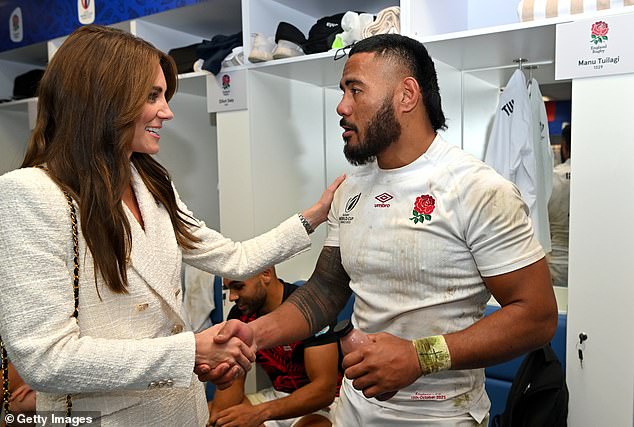 The Princess of Wales, 41, places a congratulatory hand on the shoulder of Samoan-born centre Manu Tuilagi as she shakes his hand in the dressing room