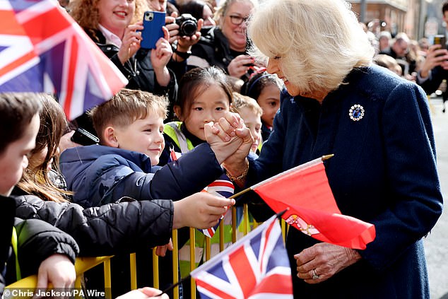 It proved to be a lighthearted moment for Camilla, as she giggled while meeting the young man