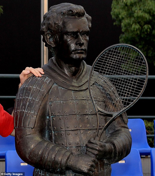 The tennis racket is a big clue here - and next to the statue is the legend himself