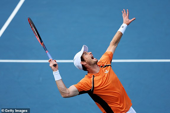 MIAMI GARDENS, FLORIDA - MARCH 21:  Andy Murray of Great Britain serves with Sebastian Korda against Julian Cash of Great Britain and Tallon Griekspoor of the Netherlands during their match on Day 6 of the Miami Open at Hard Rock Stadium on March 21, 2024 in Miami Gardens, Florida.  (Photo by Al Bello/Getty Images)