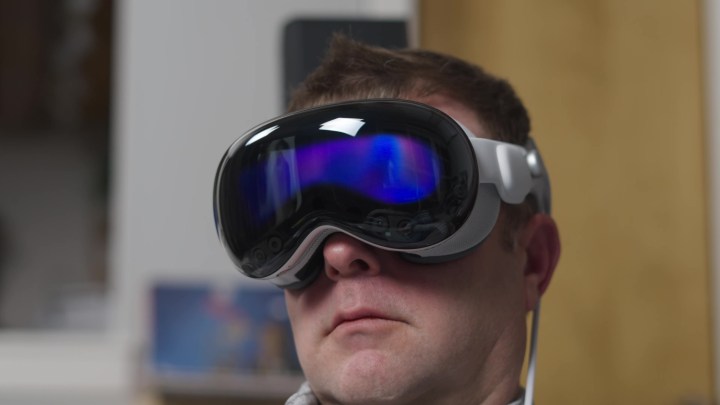 A man wearing an Apple Vision Pro headset. 