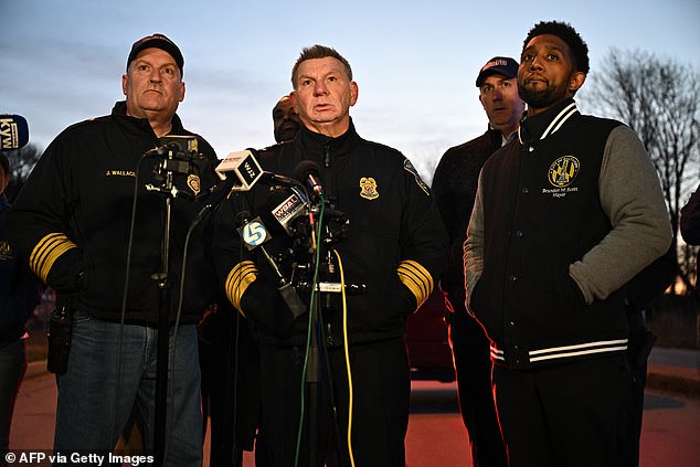 Baltimore Police Commissioner Richard Worley, with Mayor Brandon Scott (R) and Fire Department Chief James Wallace (L), speaks at a press conference on the collapse