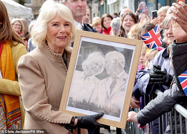 Camilla receives artwork of herself and King Charles III from a well-wisher in Shropshire today
