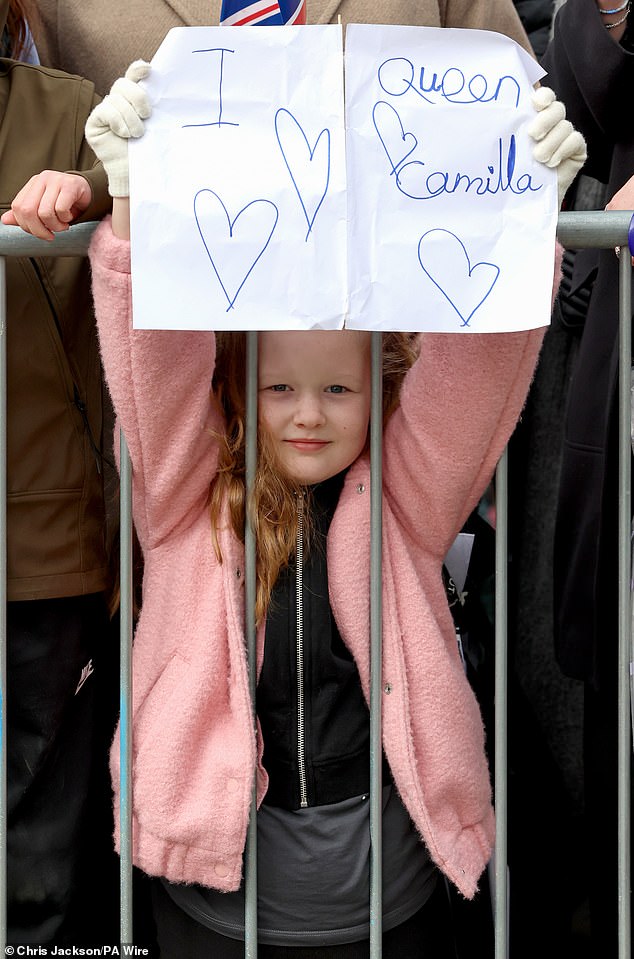 Well-wishers hold messages of support for Queen Camilla for her visit to Shrewsbury today