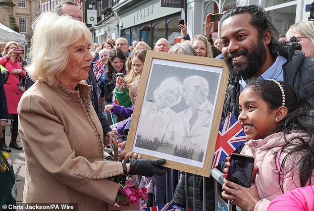 Camilla receives artwork of herself and King Charles III from a well-wisher in Shropshire today
