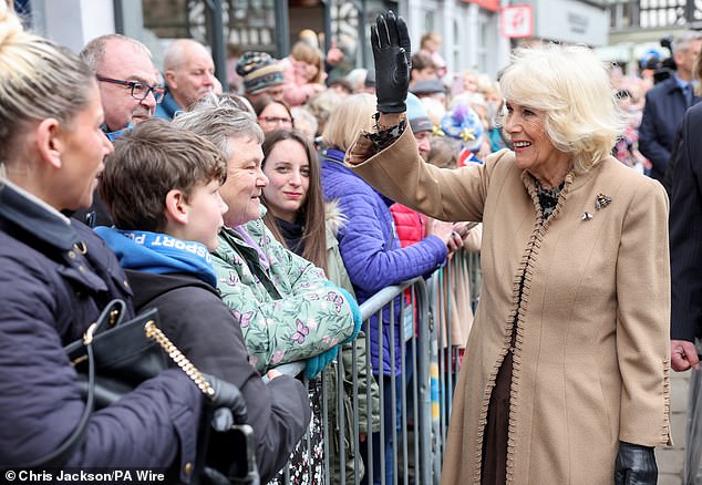 Queen Camilla greets well-wishers during a visit to the farmers' market in Shrewsbury today