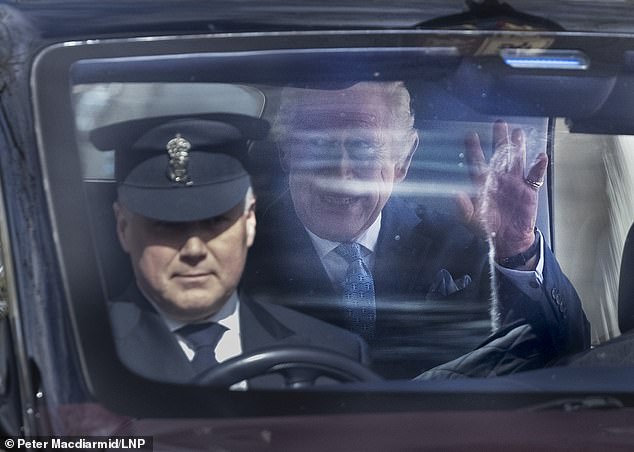 King Charles III grins to well wishers as he leaves Clarence House in London this morning