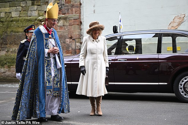 Queen Camilla walks with the Bishop of Worcester, John Inge, this morning
