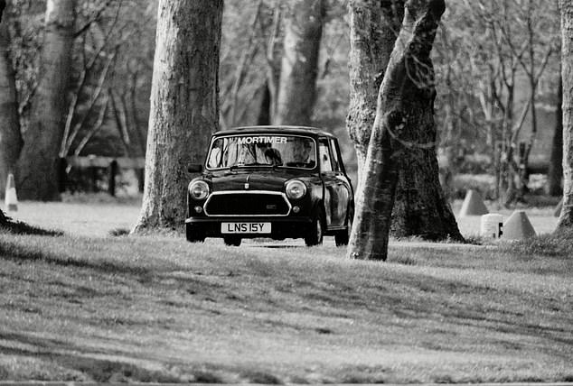 Lord Frederick Windsor, 13-year-old son of Prince and Princess Michael of Kent, learning to drive a Mini on the Queen's estate, Windsor