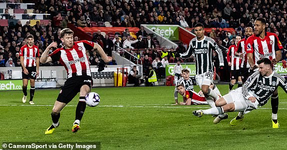 BRENTFORD, ENGLAND - MARCH 30: Manchester United's Mason Mount (right) scoring his side's first goal during the Premier League match between Brentford FC and Manchester United at Gtech Community Stadium on March 30, 2024 in Brentford, England.(Photo by Andrew Kearns - CameraSport via Getty Images)