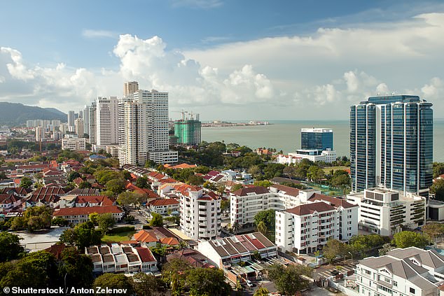 Georgetown city in Penang, Malaysia sprawls out against its jungle surroundings