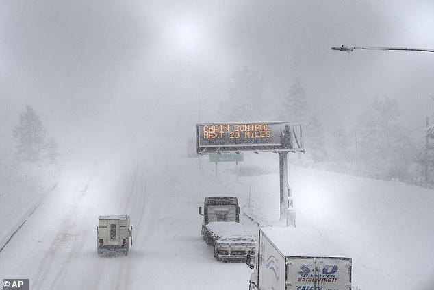 A lone camper truck moves north bound on the I-80 at the Donner Pass Exit on Friday in Truckee, California, as the most powerful Pacific storm of the season brought more than 10 feet of snow