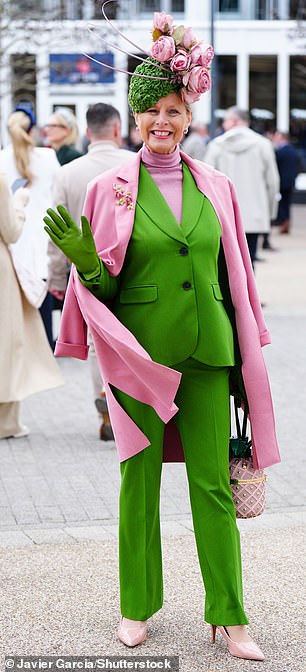 It's easy being green! One reveller stood out in signature style by teaming her green suit with a pink coat and accessories
