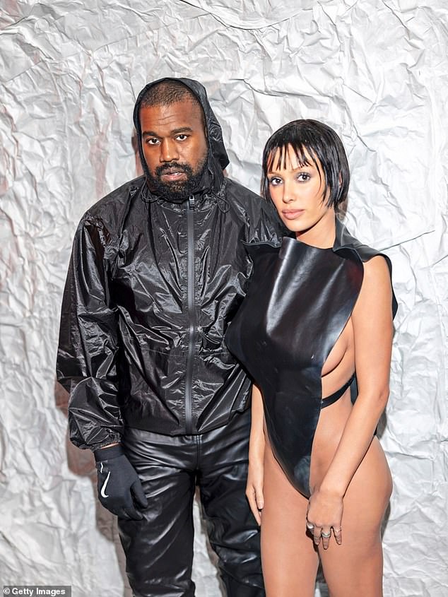 The brains behind Yeezy is styling his new 'wife', in her flesh-baring outfits. One recent look included a daring black bodysuit that barely contained her curves. At Milan Fashion Week , Bianca, 29, went braless with the revealing garment featuring a matching strap along the sides