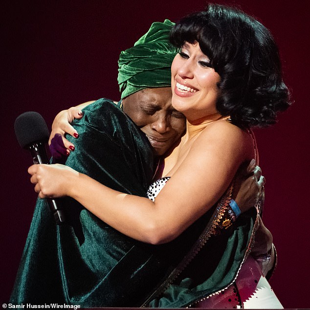 Pictured: Raye seen hugging her emotional grandmother Agatha Dawson as she wins Album of the Year at last night's BRIT Awards