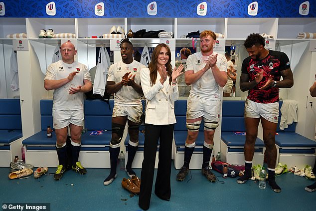 Kate Middleton beams as she applauds England's rugby team after it saw off Fiji to progress to the semi-finals of the Rugby World Cup in October 2022