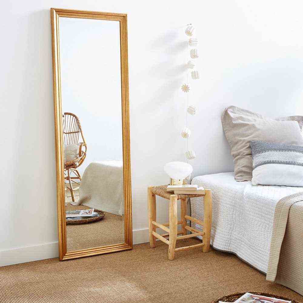 Large mirror in a room without window 