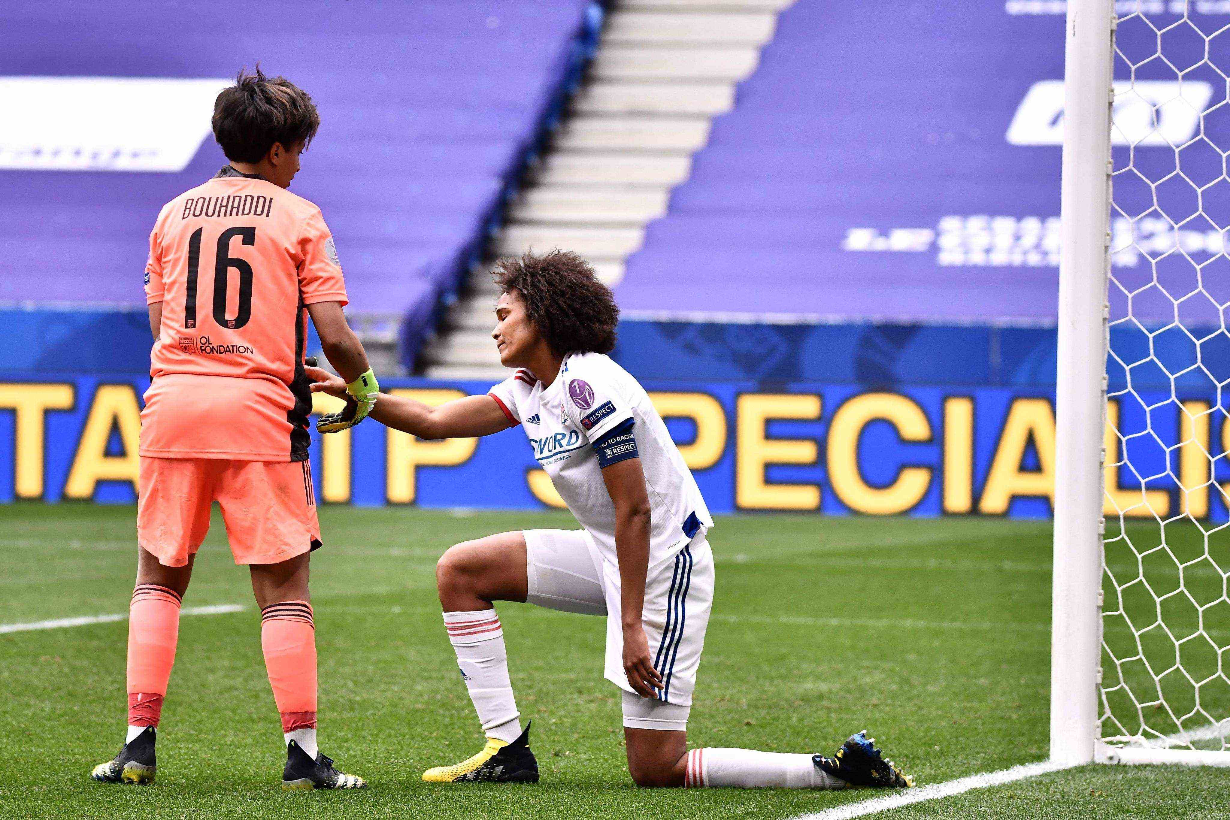 Sarah Bouhaddi tries to comfort her captain Wendie Renard after her terrible goal against her camp.  JEFF PACHOUD 