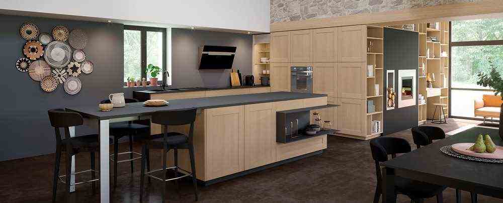The black and wood kitchen reverses the trend -