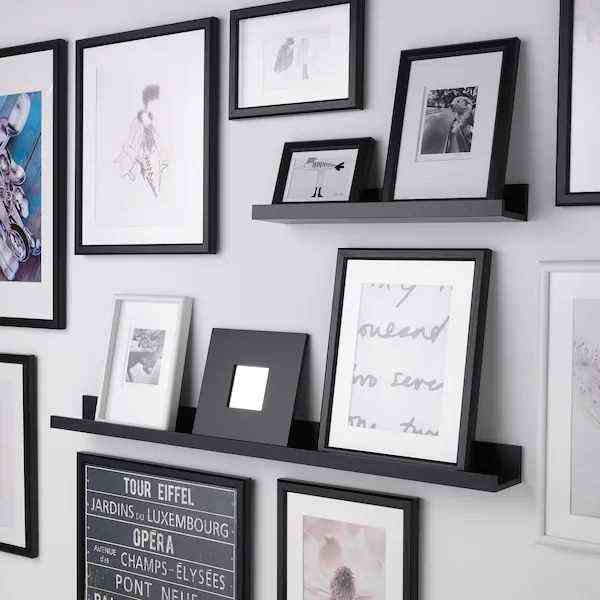 Wall Of Frames And Shelves