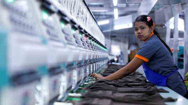 A laborer works at a garment factory in Bangkok