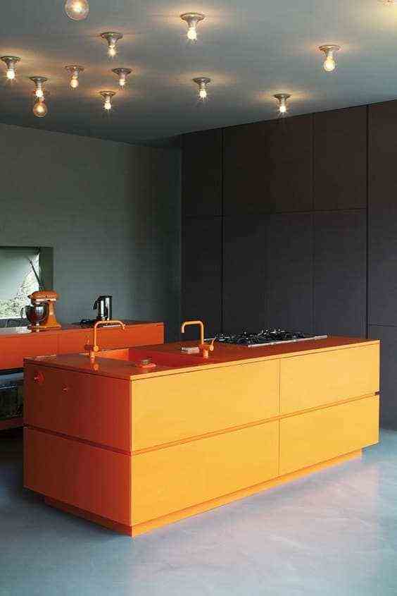A contemporary orange kitchen