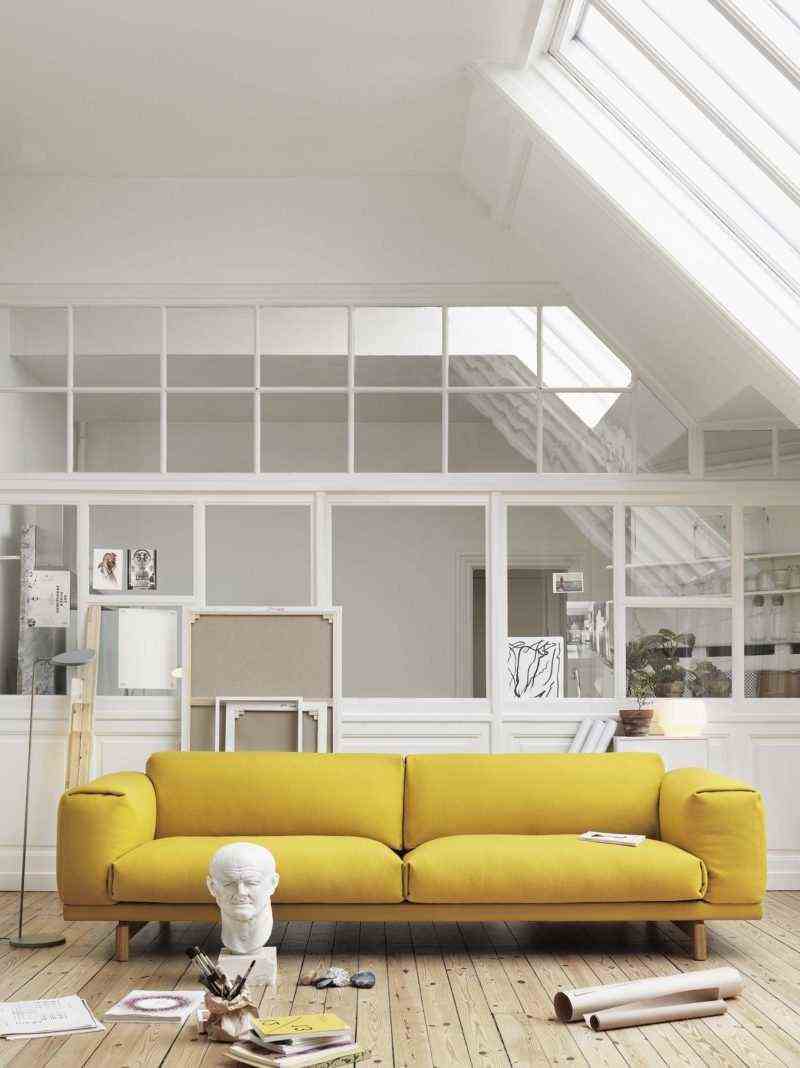 The yellow sofa to illuminate the white living room 