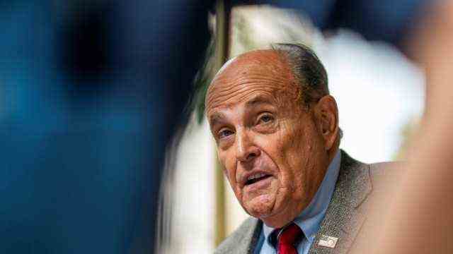 Former New York City Mayor Giuliani speaks to media about the US evacuation of Afghanistan outside his apartment building in New York
